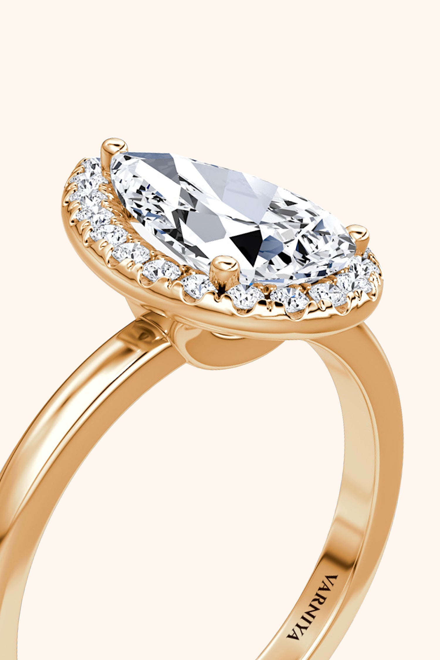 Angelica Pear Solitaire Ring with a Classic Halo