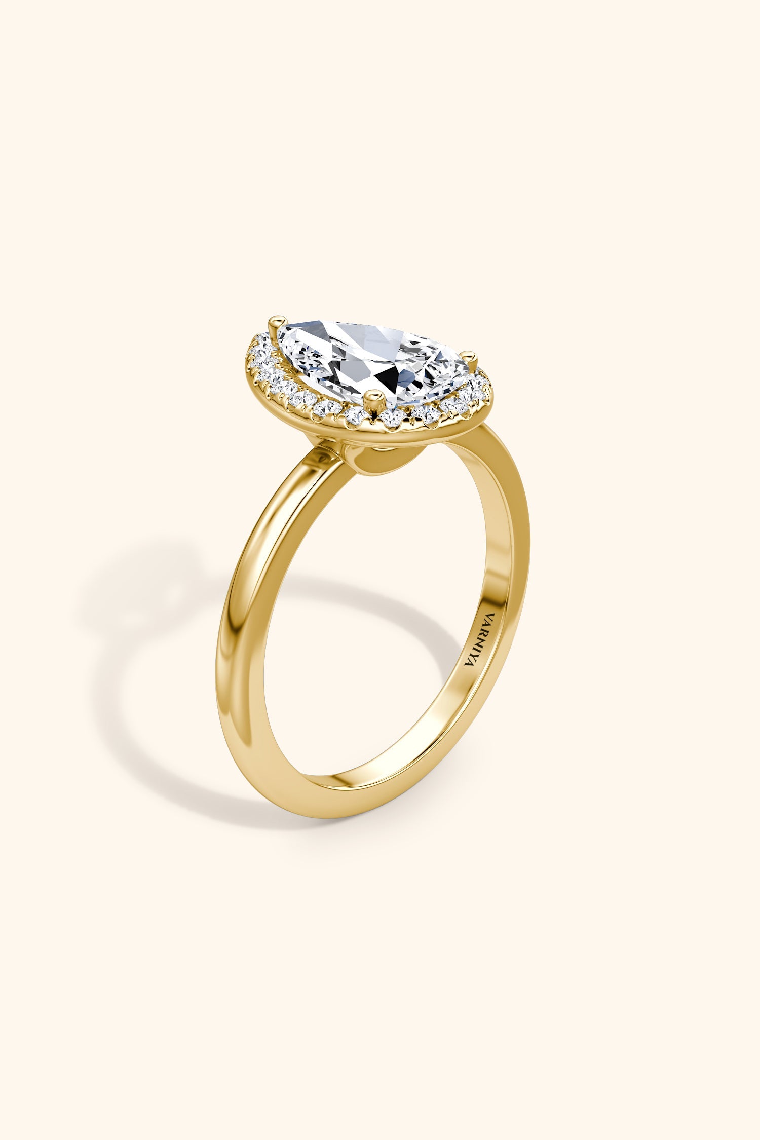 Angelica Pear Solitaire Ring with a Classic Halo