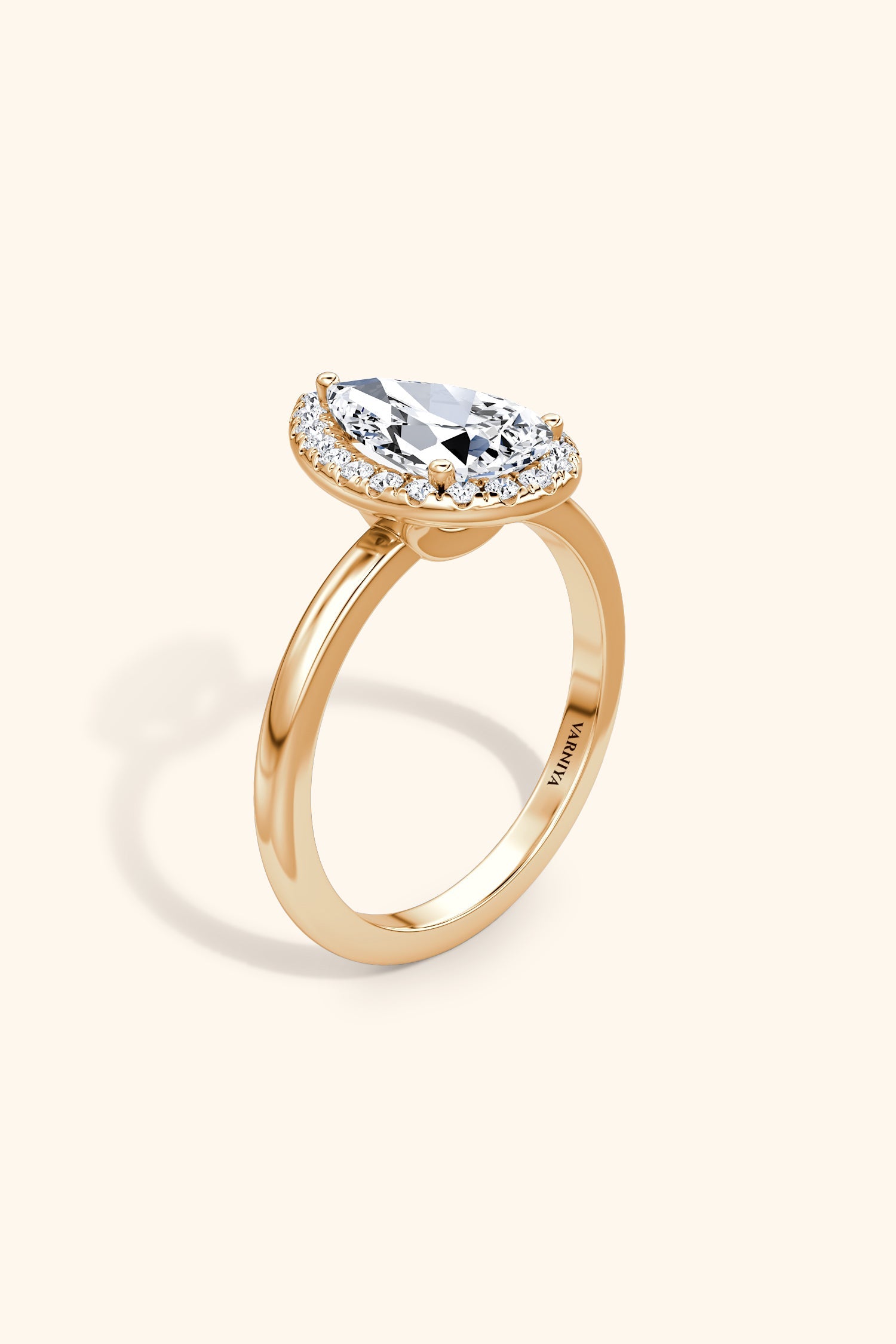 Angelica Pear Solitaire Ring with a Classic Halo